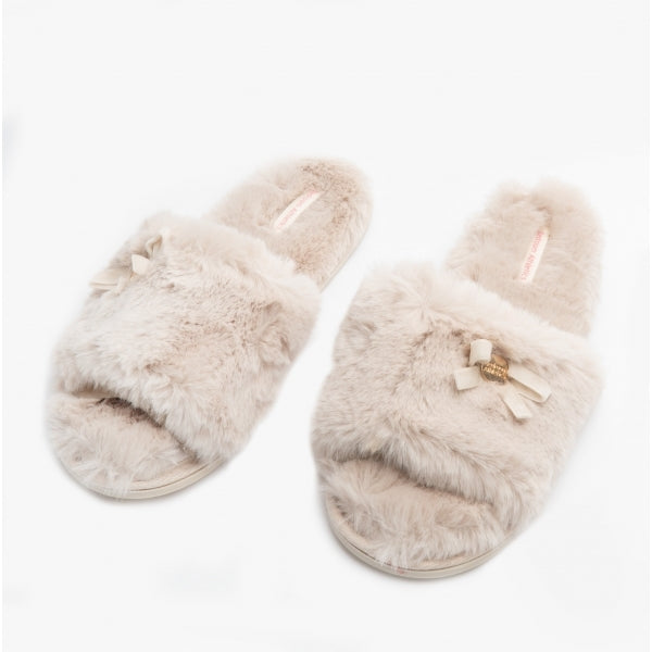 Bedroom Athletics RUBY Womens Faux Fur Slide Slippers Cream side view showcasing soft faux fur design and decorative bow.
