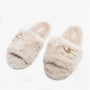 Bedroom Athletics RUBY Womens Faux Fur Slide Slippers Cream side view showcasing soft faux fur design and decorative bow.