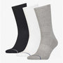 Calvin Klein 3 Pack Mens Crew Trainer Socks Grey, side view showcasing grey, black, and white socks, ribbed design.