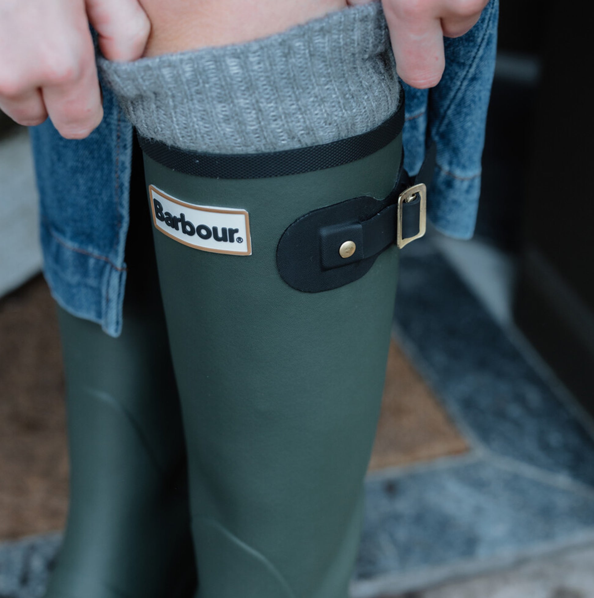 Barbour SNOWDON Womens Tall Wellies Olive/Black detail view showcasing the boots with buckle and logo.