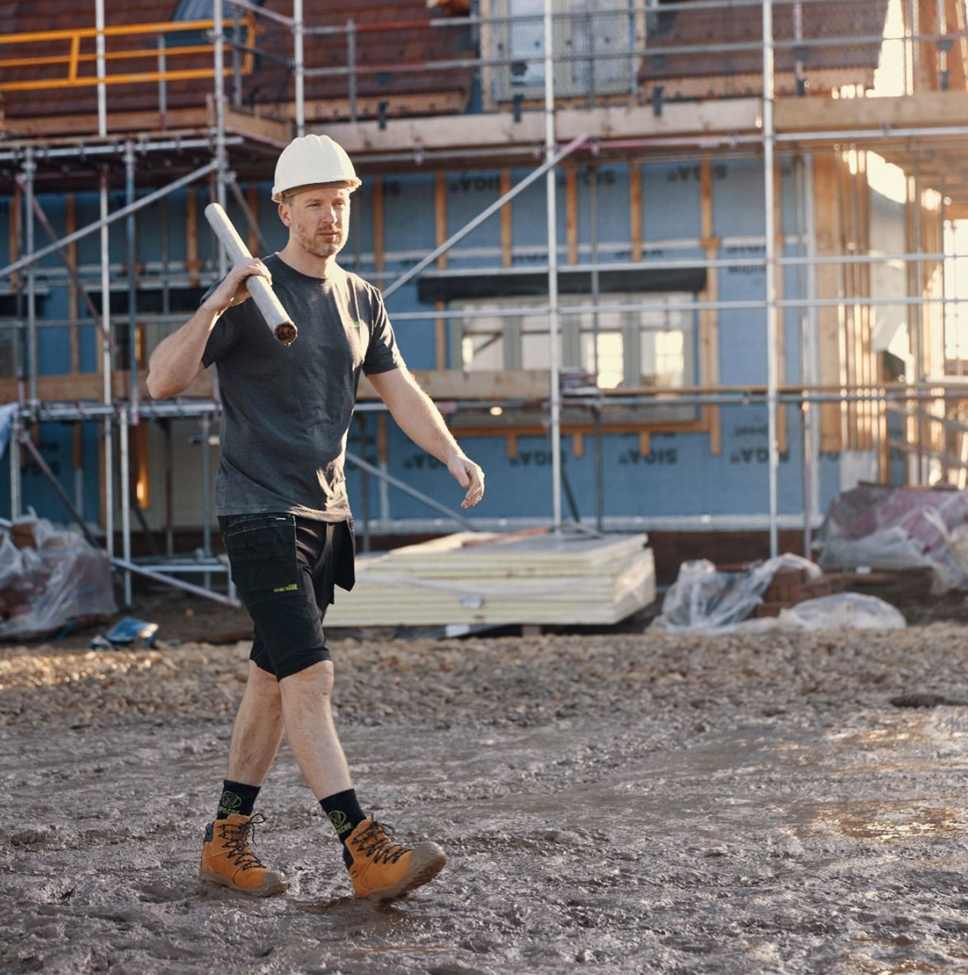 Apache AP314CM Mens Boots Wheat worn by a construction worker walking on site, side view, showing safety features and style.