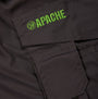 Detail view of Apache APKHT Mens Shorts Grey, featuring green logo and pocket detail.