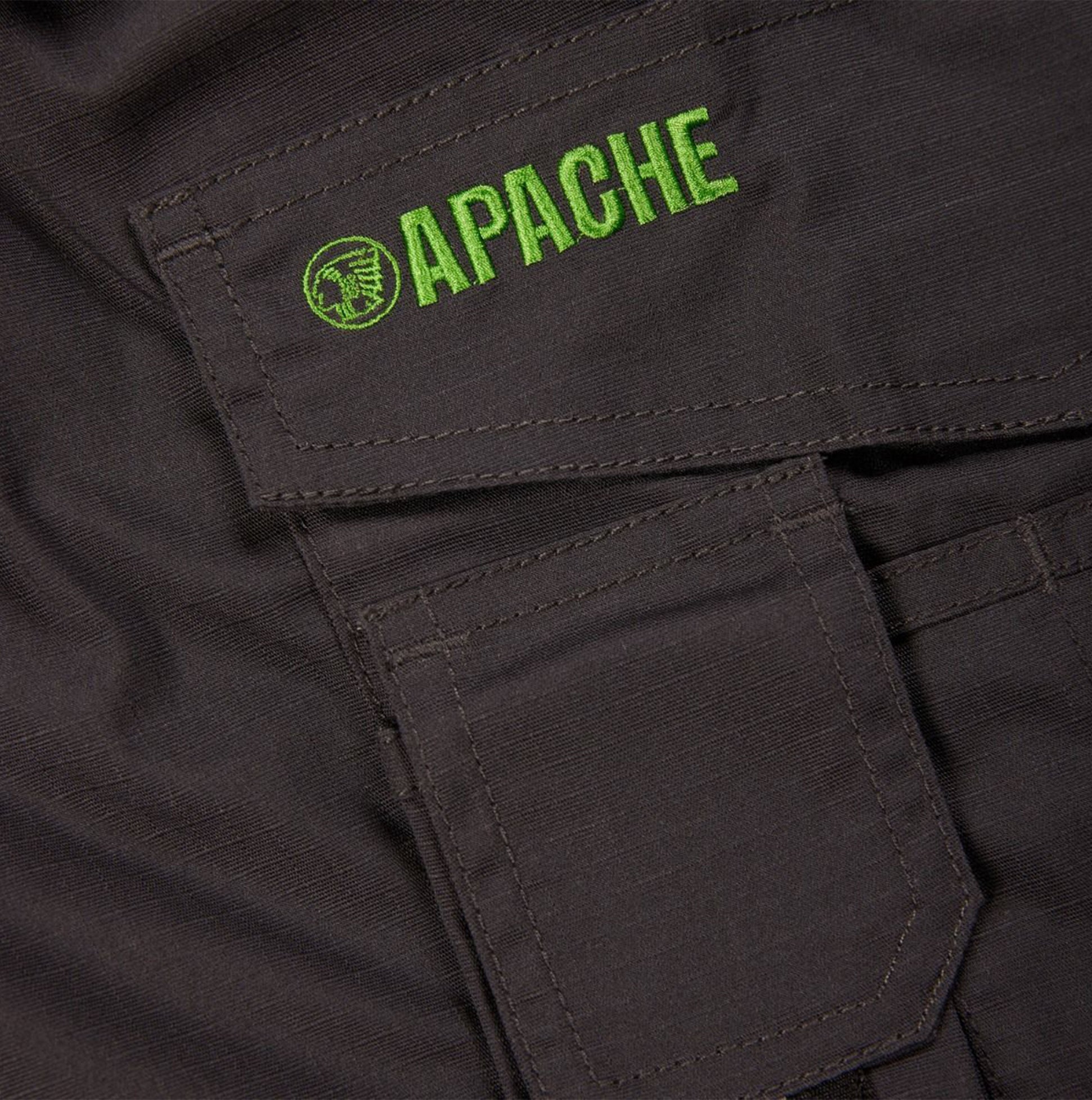 Detail view of Apache APKHT Mens Shorts Grey, featuring green logo and pocket detail.