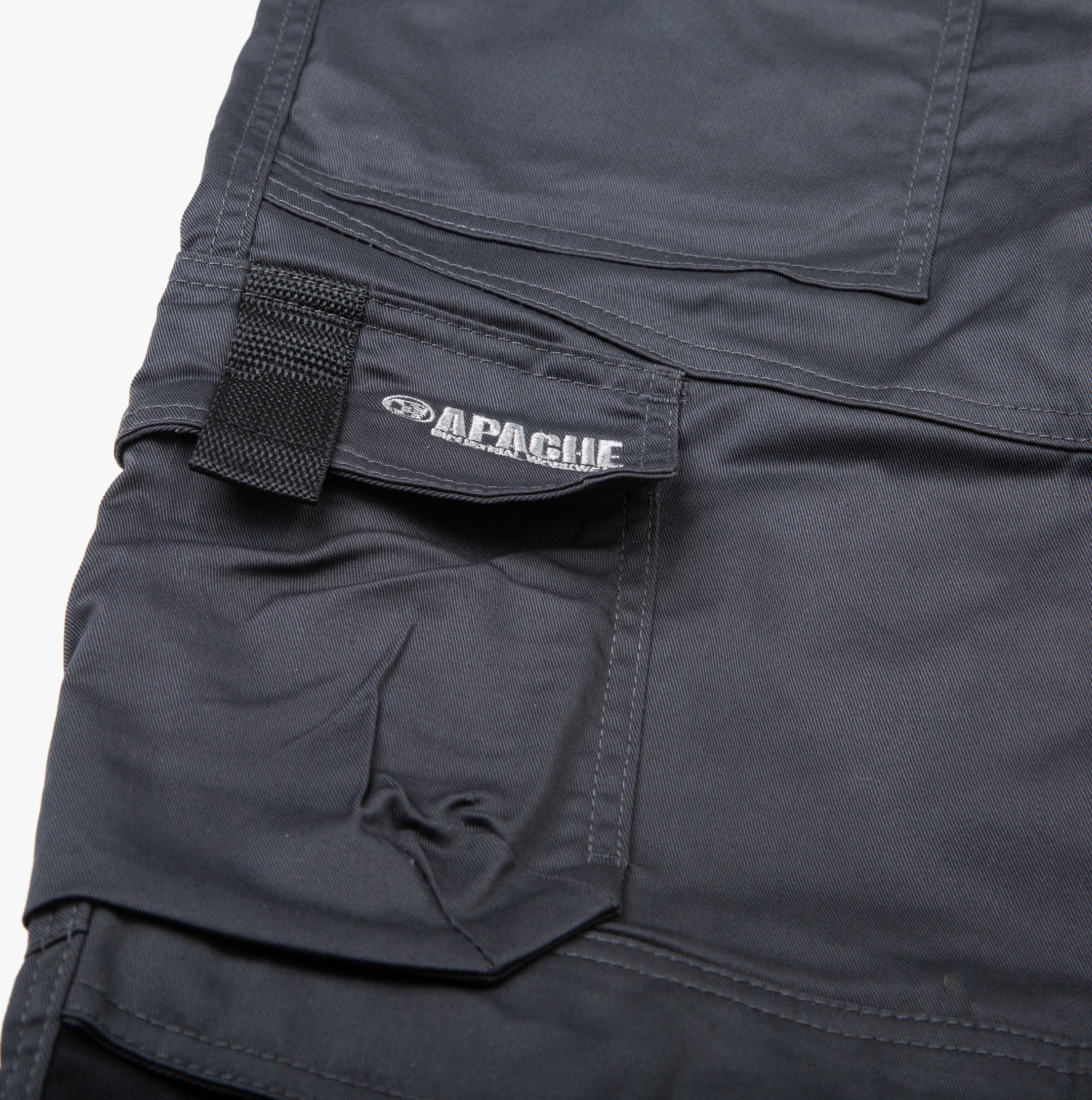 Detail view of Apache ATS Mens Trousers Grey showing pockets and label.