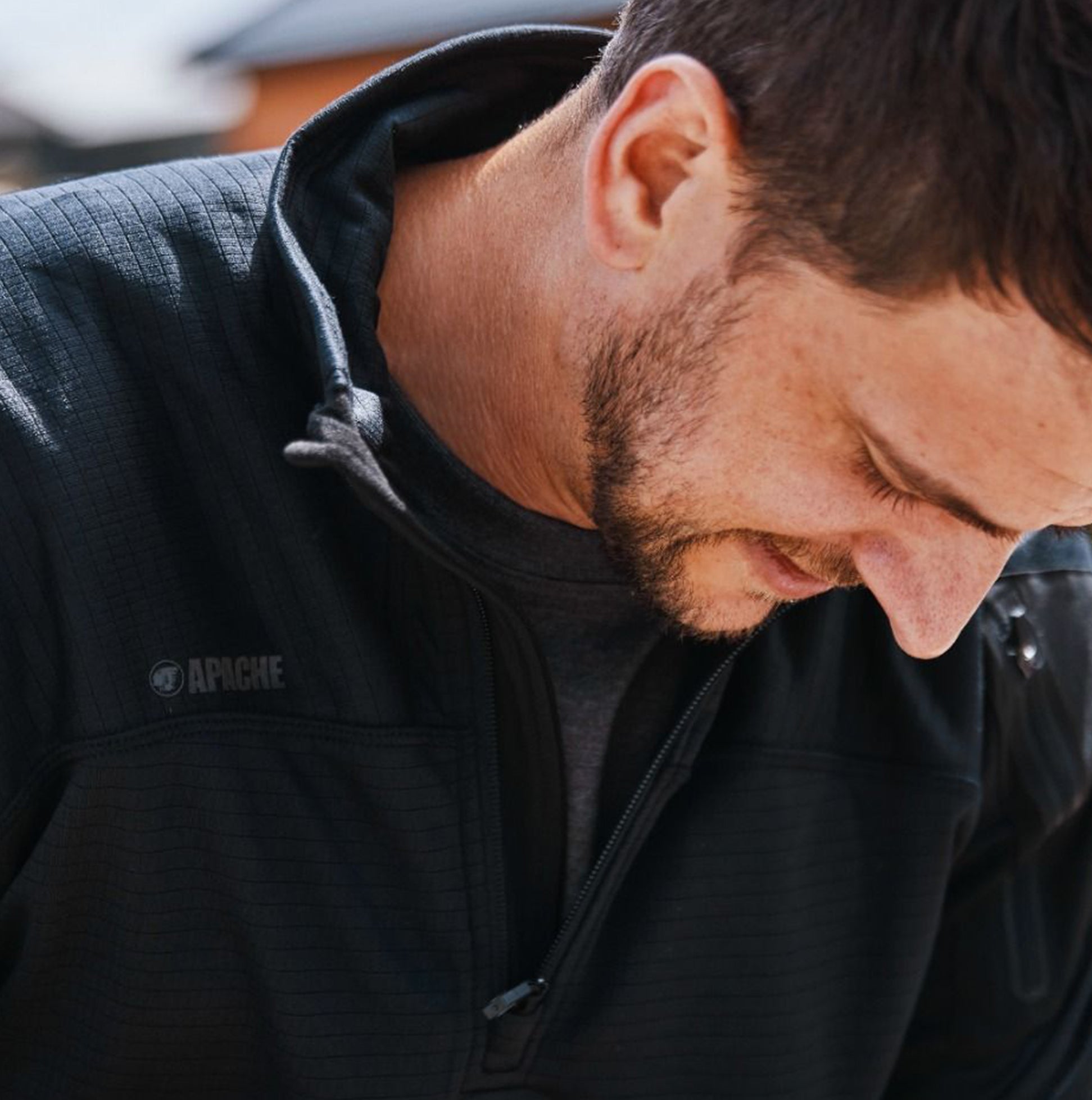 Apache ATS TECH Mens Quarter-Zip Fleece Black detail view showing fabric texture and collar style worn by a man.