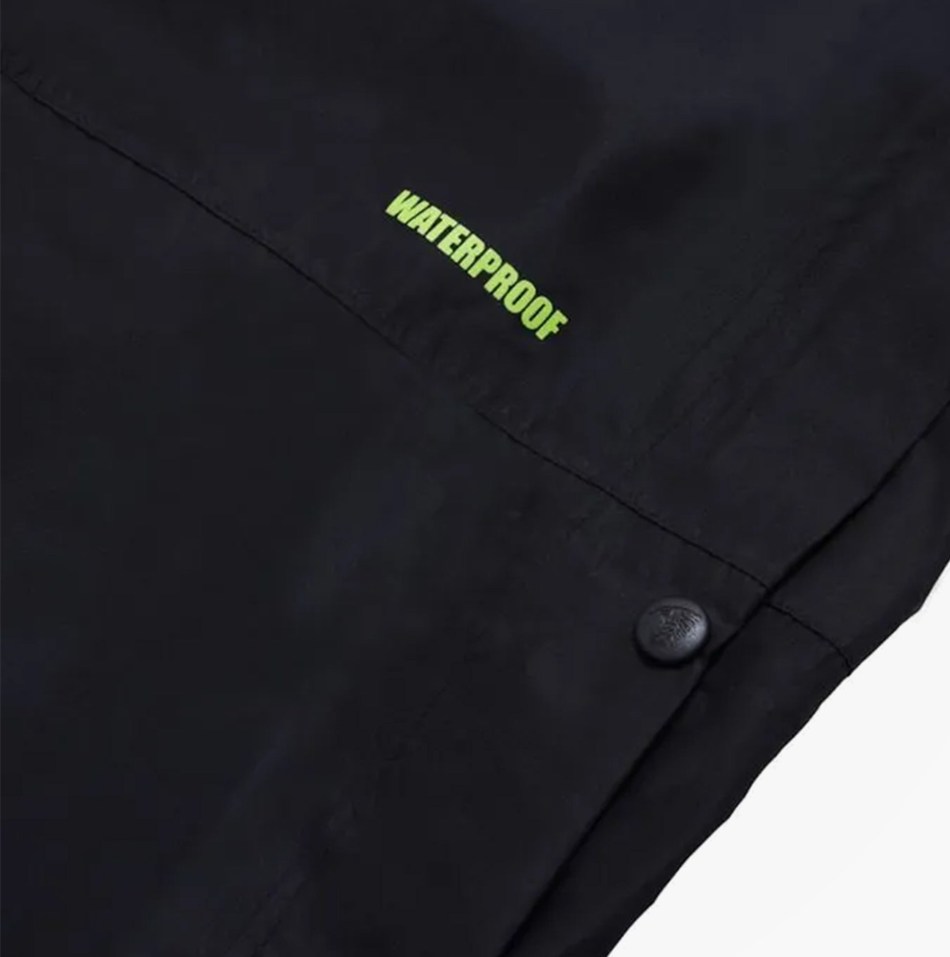 Apache QUEBEC Mens Over Trousers Black detail view showing waterproof feature and button.