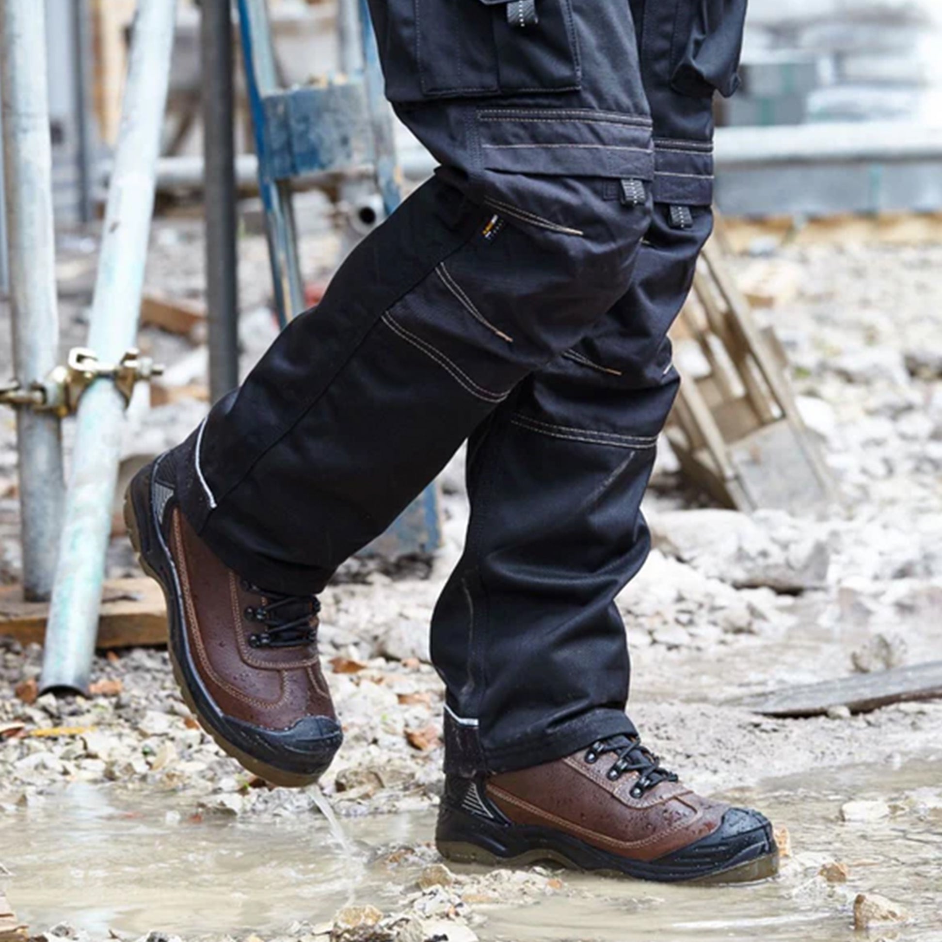 Apache RANGER Unisex Boots Brown side view worn in puddle, showcasing comfort and water resistance features.