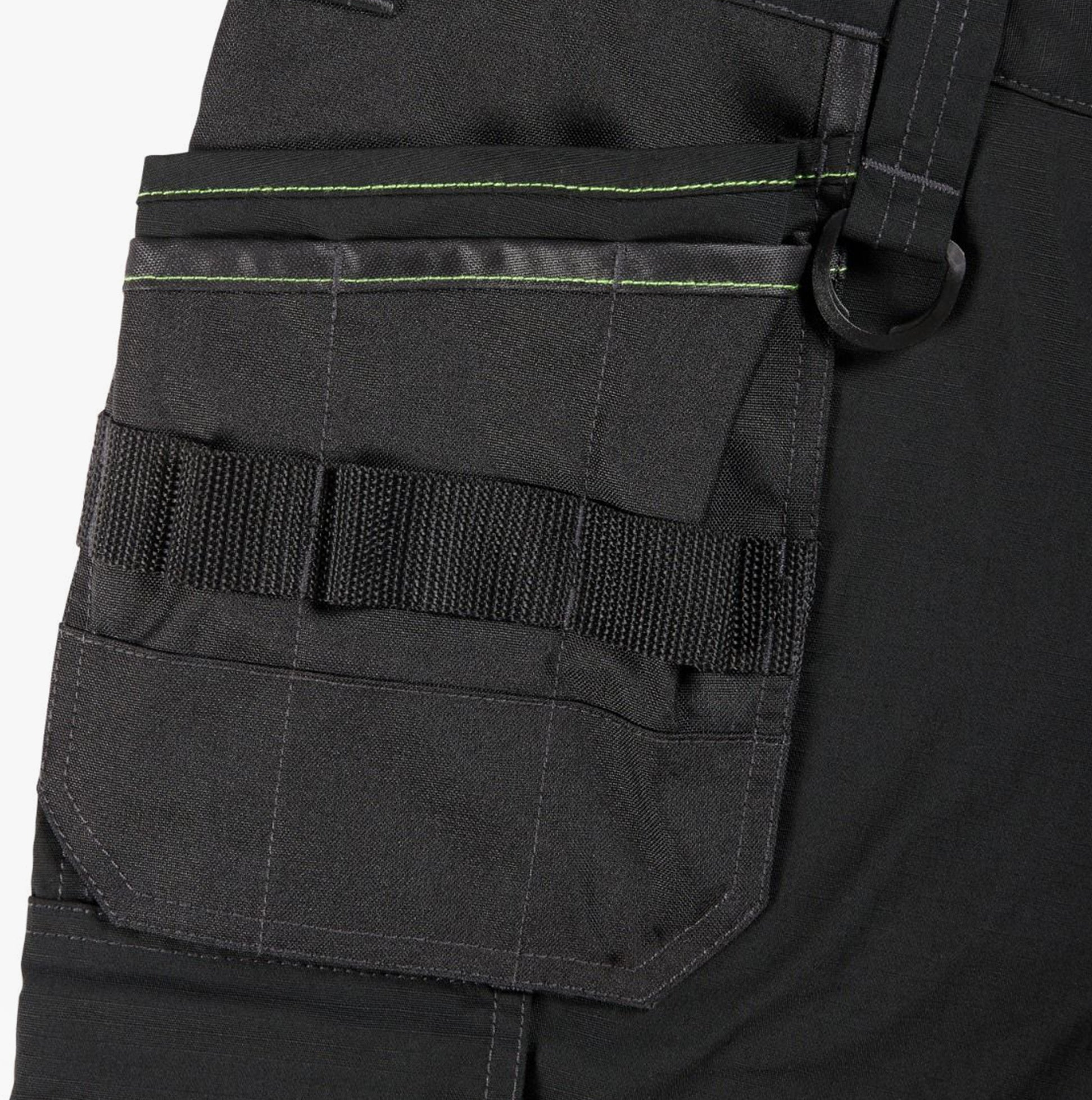 Apache SUDBURY Mens Trousers Black detail view of cargo pocket with belt loops and green stitching.