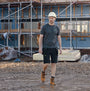 Apache VANCOUVER Mens T Shirt Grey front view on a construction site, worn with black shorts and safety gear.