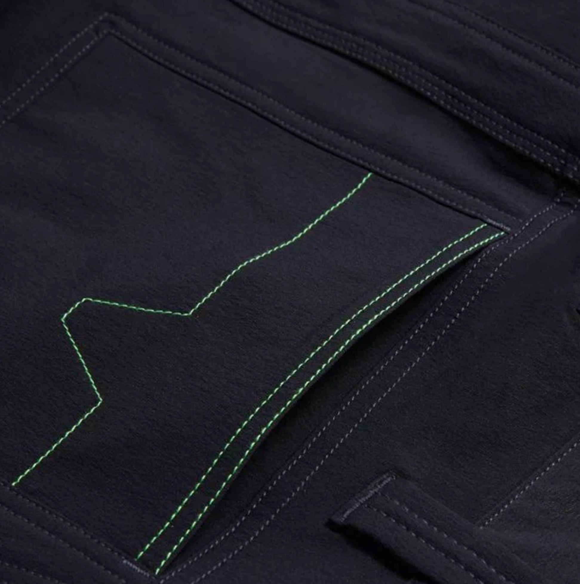 Apache WHISTLER Mens Workwear Shorts Black detail view of side cargo pocket with green stitching.