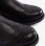 Band Wagon ELGIN Mens Chelsea Boots Black detail view highlighting leather texture and decorative perforations.