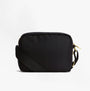 Barbour B.INTL QUALIFY Womens Crossbody Bag Black side view featuring adjustable strap and zip closure.
