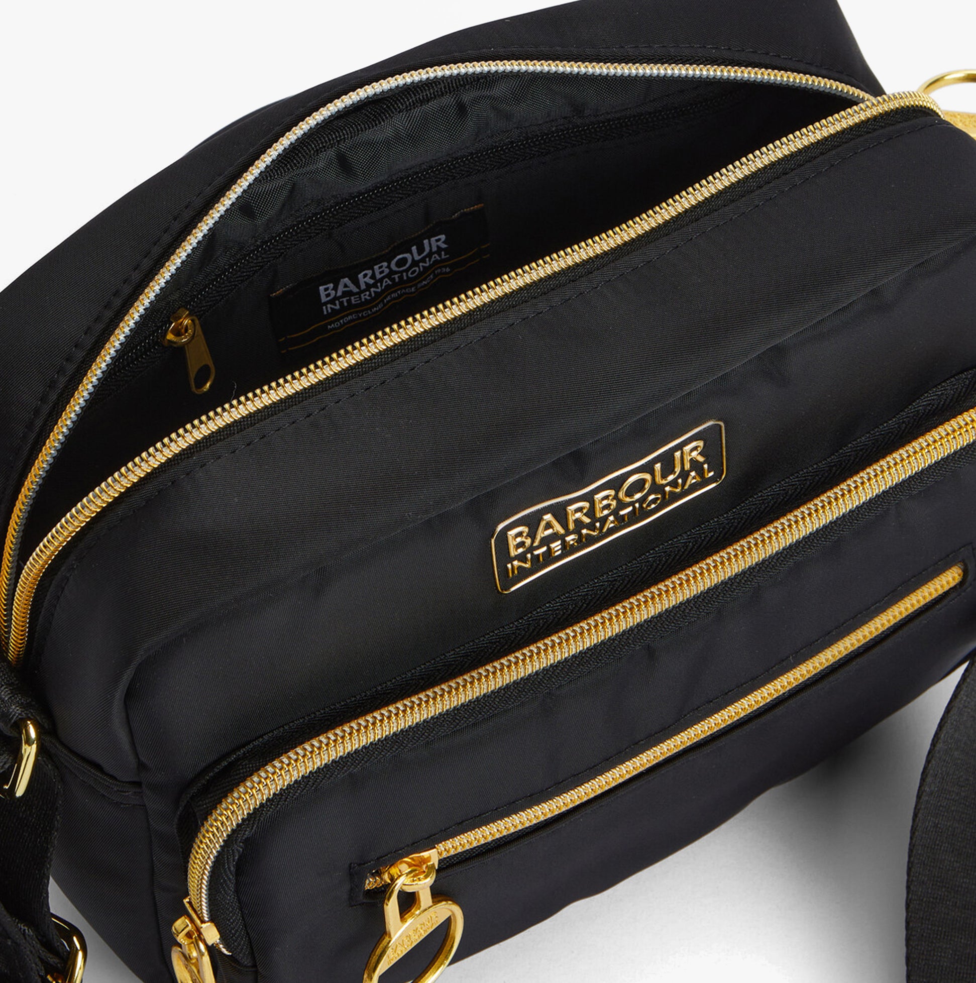 Barbour B.INTL QUALIFY Womens Crossbody Bag Black detail view of zippers and lining.