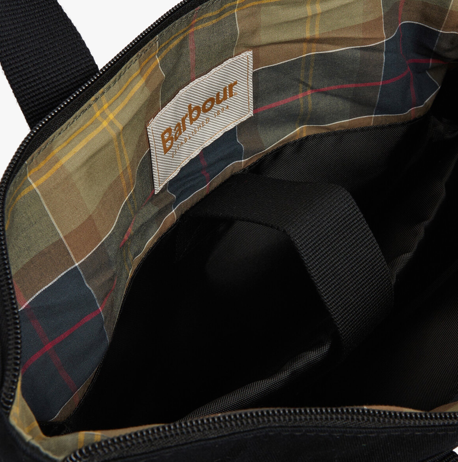 Barbour OLIVIA Womens Backpack Black interior detail view showing plaid lining and logo.