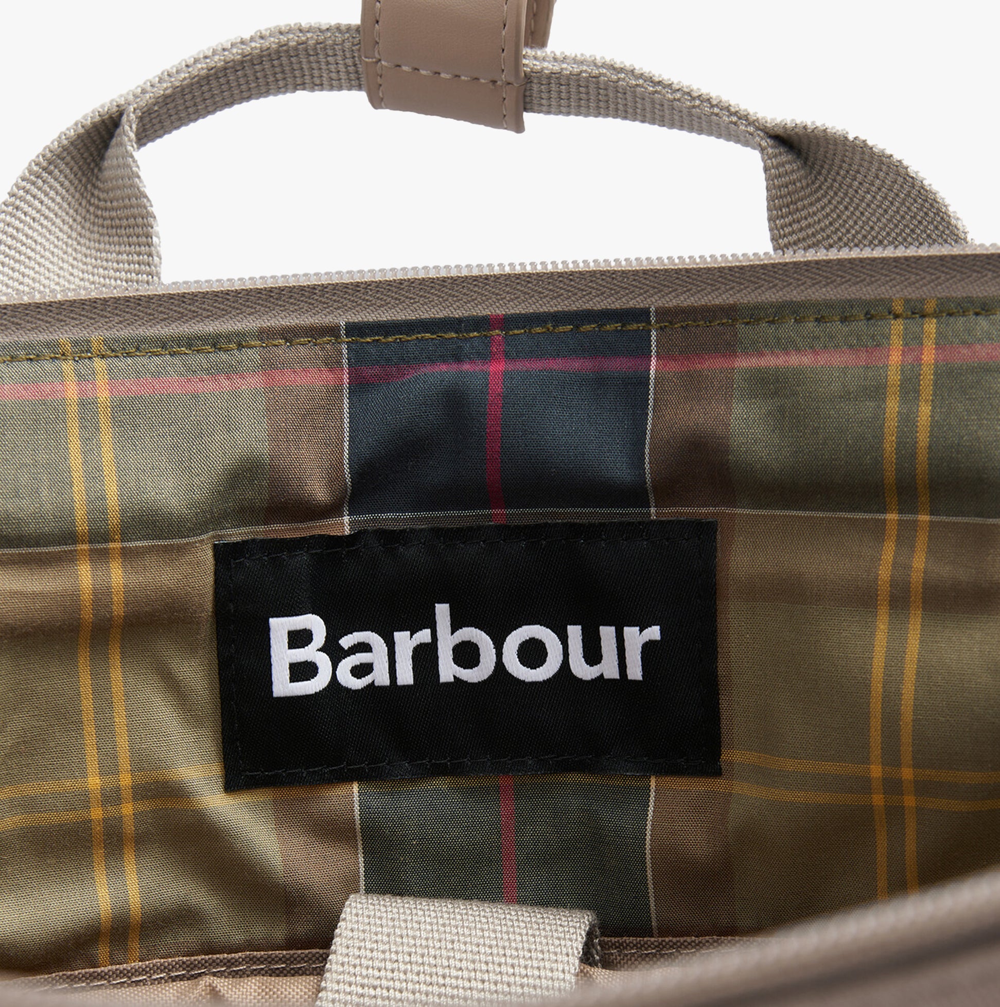 Barbour OLIVIA Womens Backpack Light Sand interior view with brand label and plaid lining pattern.