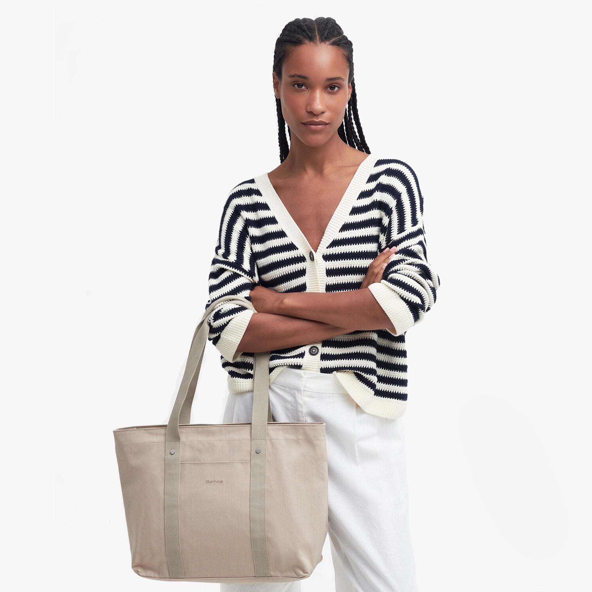 Barbour OLIVIA Womens Tote Bag Light Sand front view, model holding bag, wearing striped cardigan.