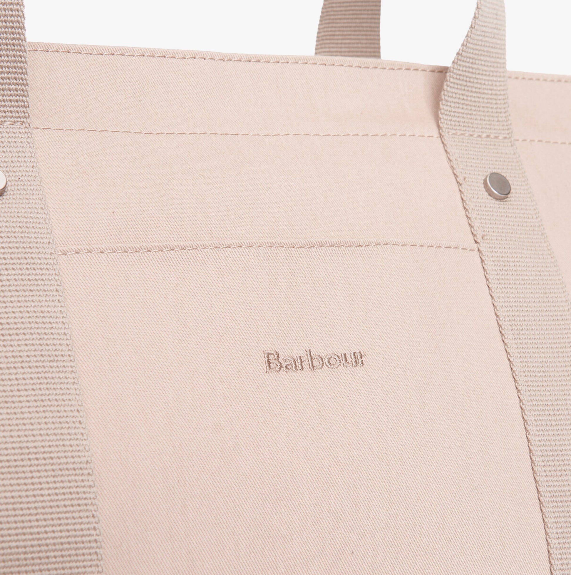 Detail view of Barbour OLIVIA Womens Tote Bag Light Sand showcasing logo and fabric texture.