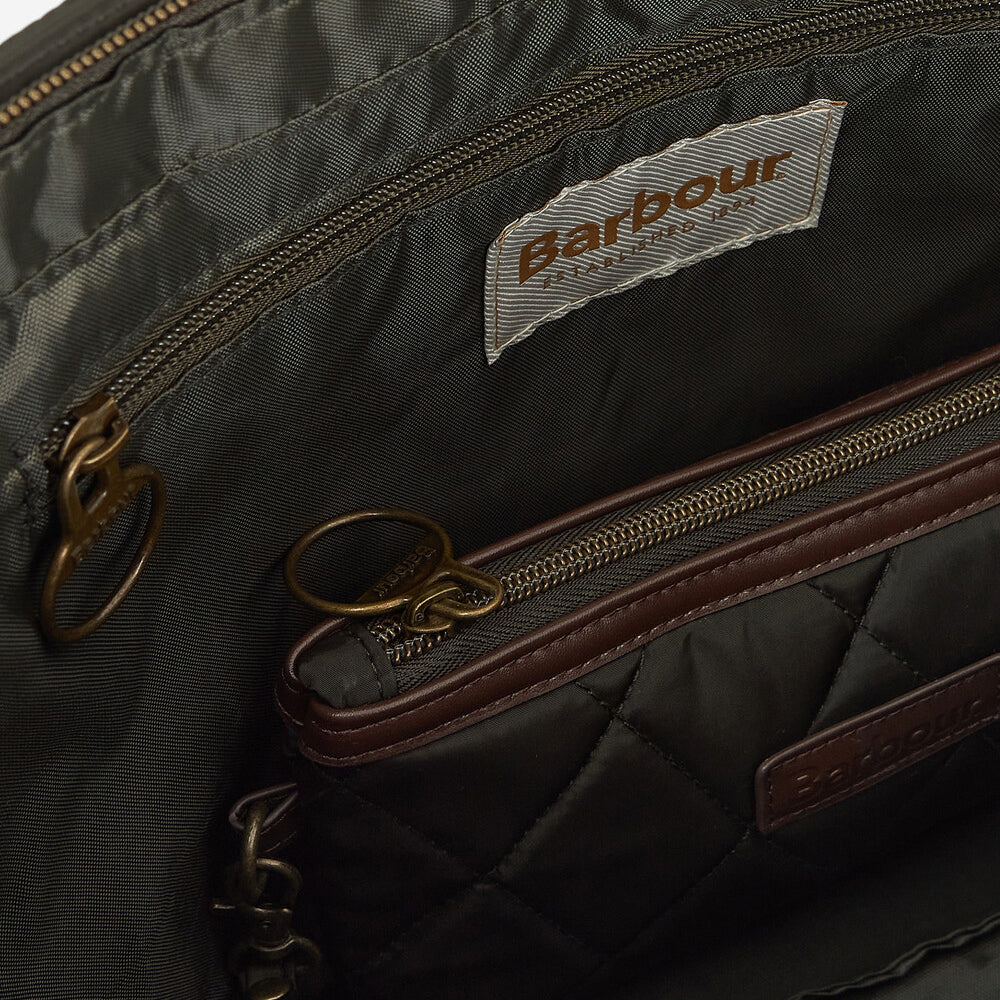 Detail view of Barbour QUILTED Womens Tote Bag Olive interior, showing zippered pockets and fabric lining.