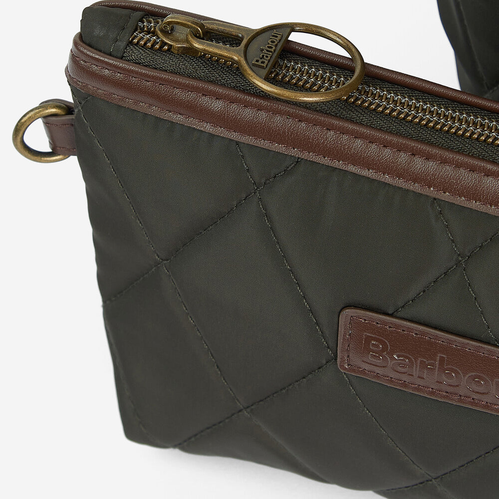 Detail view of Barbour QUILTED Womens Tote Bag Olive, showcasing the zip closure and leather-look handle.