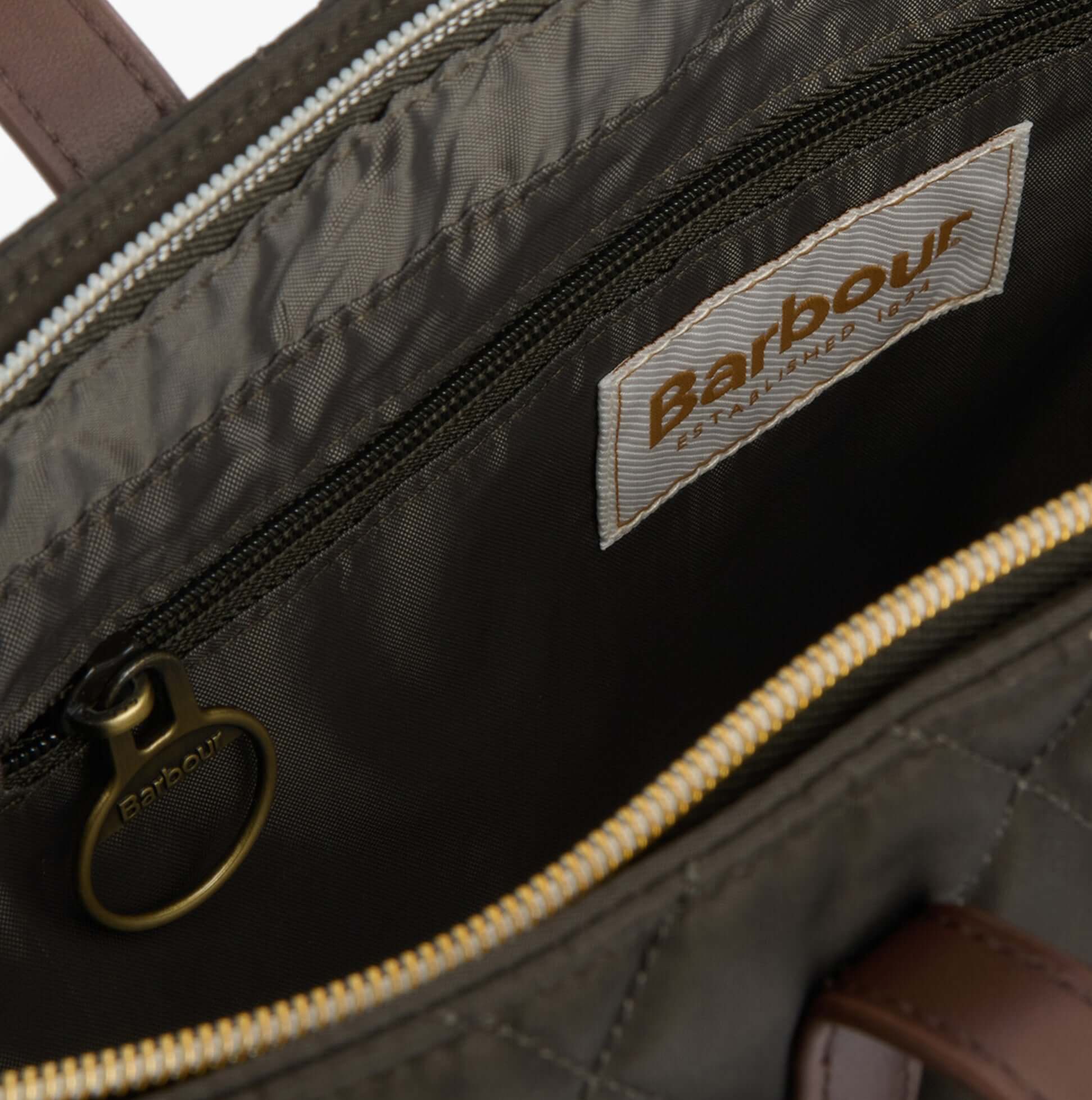 Barbour QUILTED Womens Tote Bag & Purse Olive interior detail view with zip pocket and brand label.