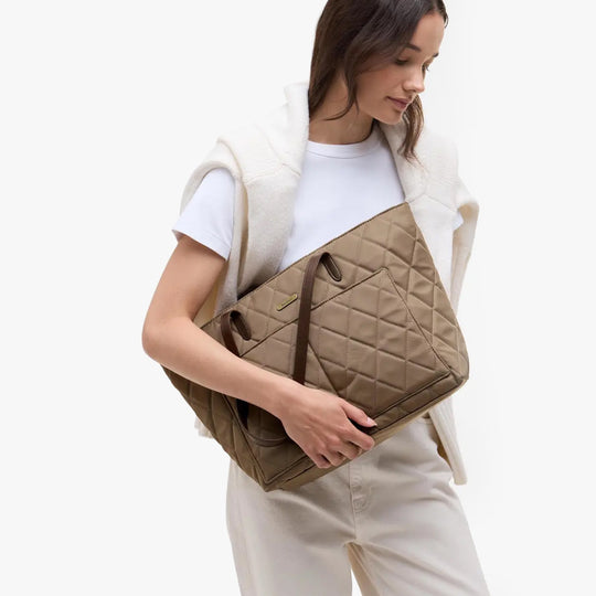 Barbour QUILTED Womens Tote Bag & Purse Sand front view held by model wearing casual outfit