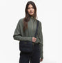 Barbour MONACO QUILT Womens Crossbody Bag Black front view with model wearing sweater and bag over shoulder.
