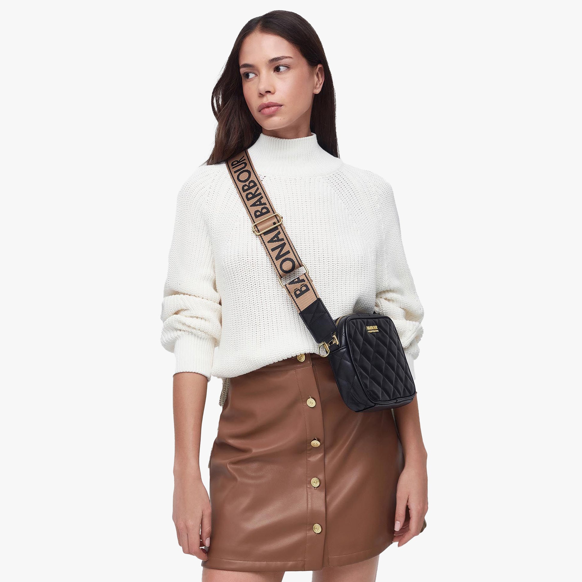 Barbour QUILTED SLOANE Womens Crossbody Bag Black shown on model with adjustable strap and quilted design.