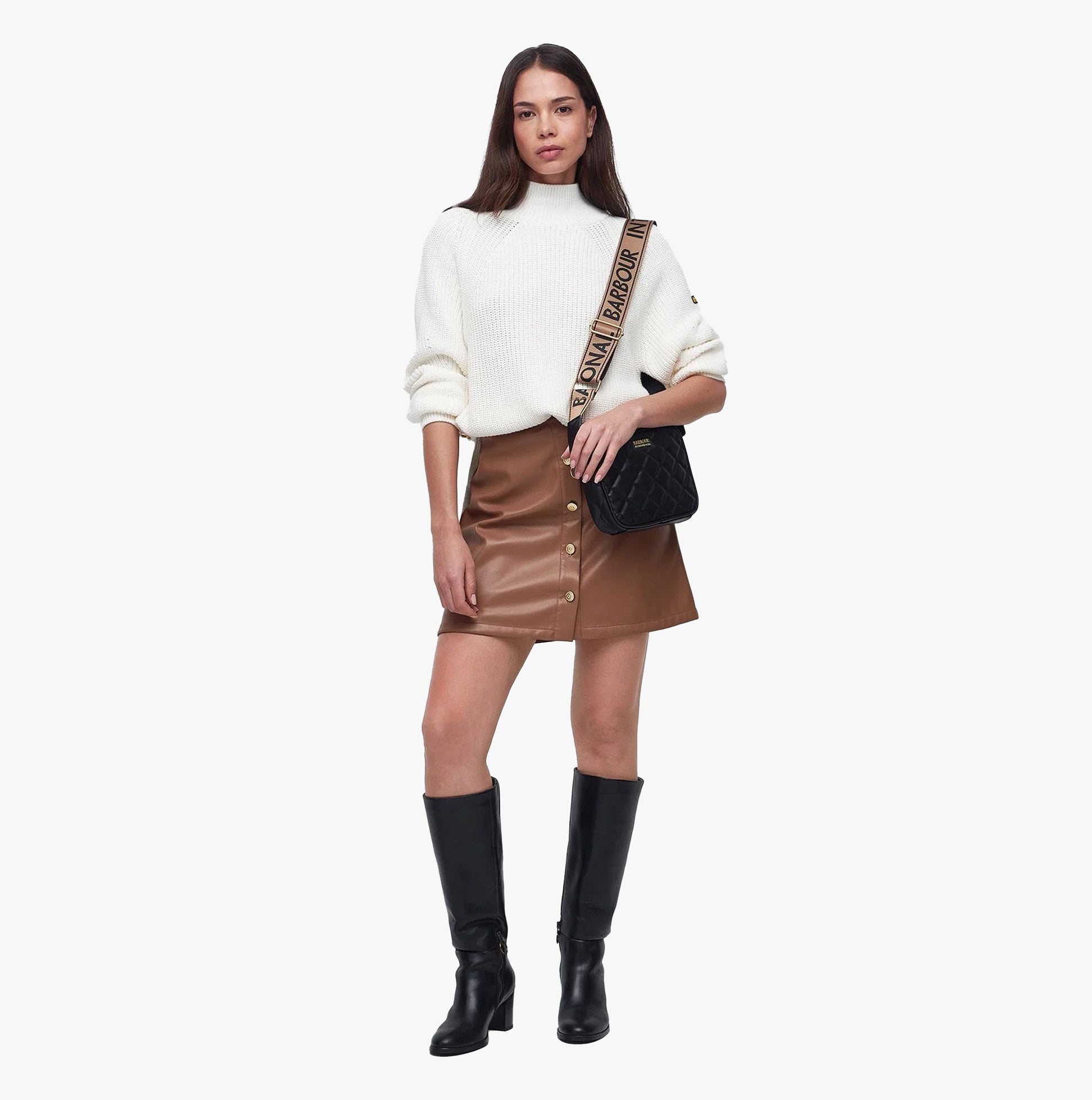 Barbour QUILTED SLOANE Womens Crossbody Bag Black worn with a stylish outfit in a front view.