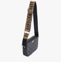 Barbour QUILTED SLOANE Womens Crossbody Bag Black side view showcasing adjustable strap and quilted design.