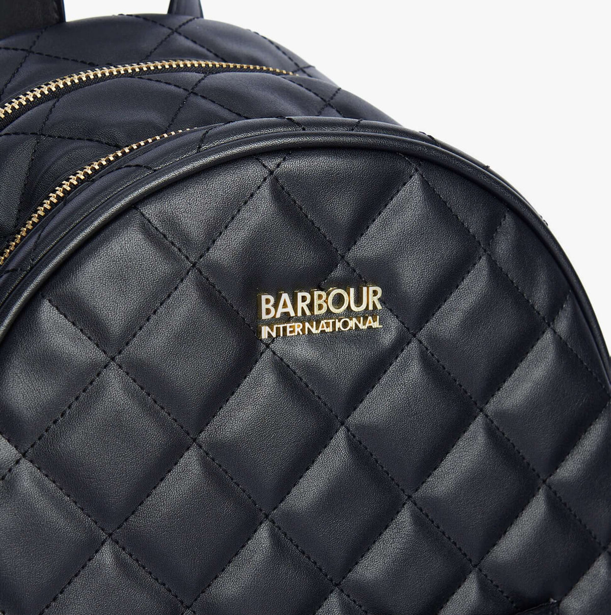 Barbour QUILTED UXBRIDGE Womens Backpack Black detail view showing quilting and logo.