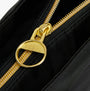 Detail view of Barbour B.INTL QUALIFY Womens Tote Bag Black zipper with gold hardware.