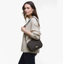 Barbour QUILTED Crossbody Bag Womens Olive side view on model wearing a beige sweater, showcasing the quilted design and strap.
