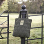 Barbour MARIAH QUILTED Womens Tote Bag Olive hanging on a fence post, showcasing its quilted design and woven logo.