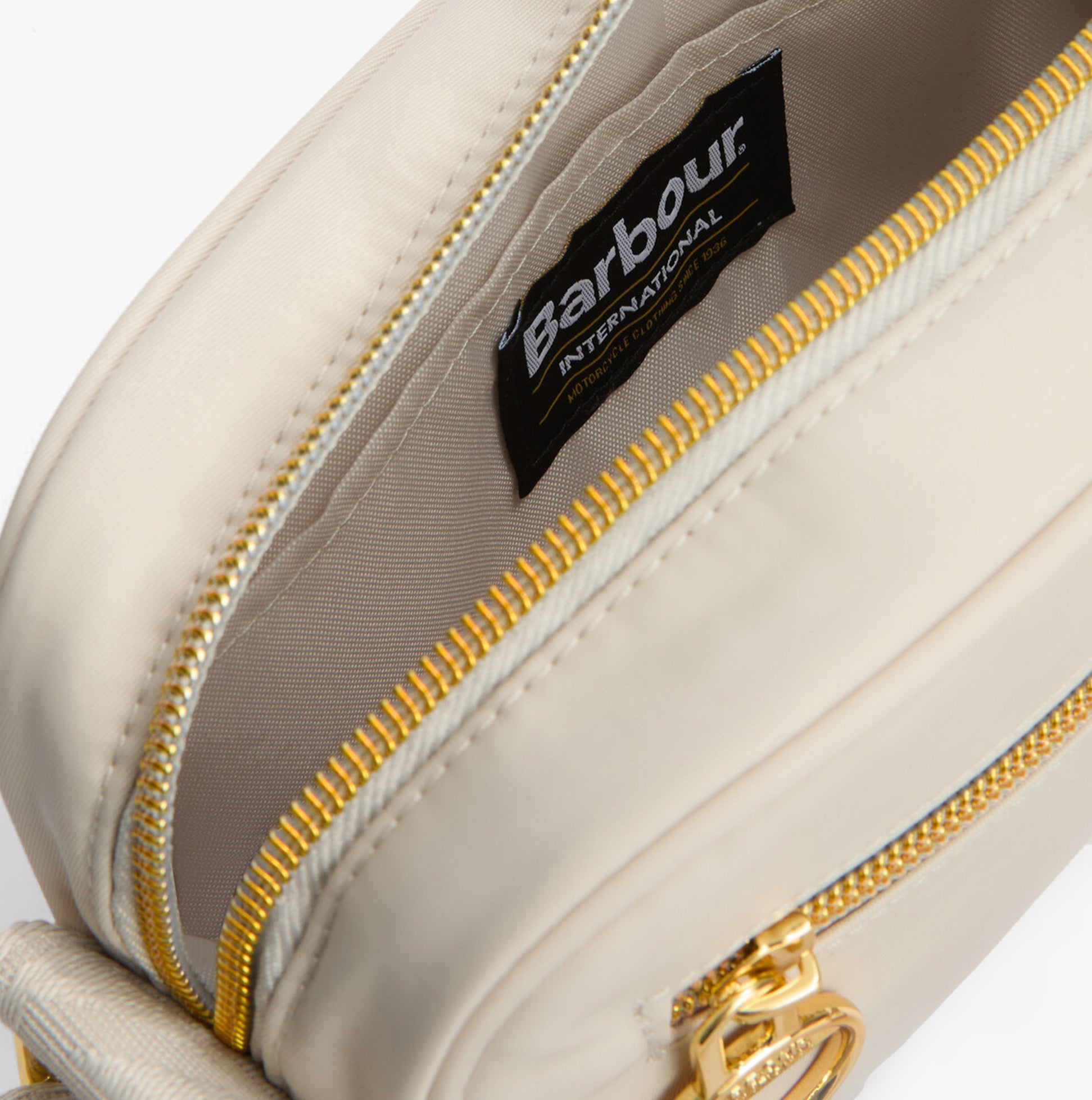 Barbour B.INTL MICRO QUALIFY Womens Crossbody Bag Light Pearl detail view of inner lining and zipper.