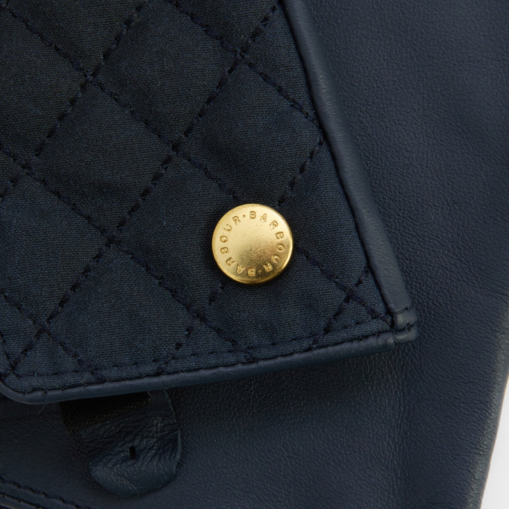 Barbour SCARLET Womens Touchscreen Gloves Navy detail view showcasing gold branded rivet on quilted leather.