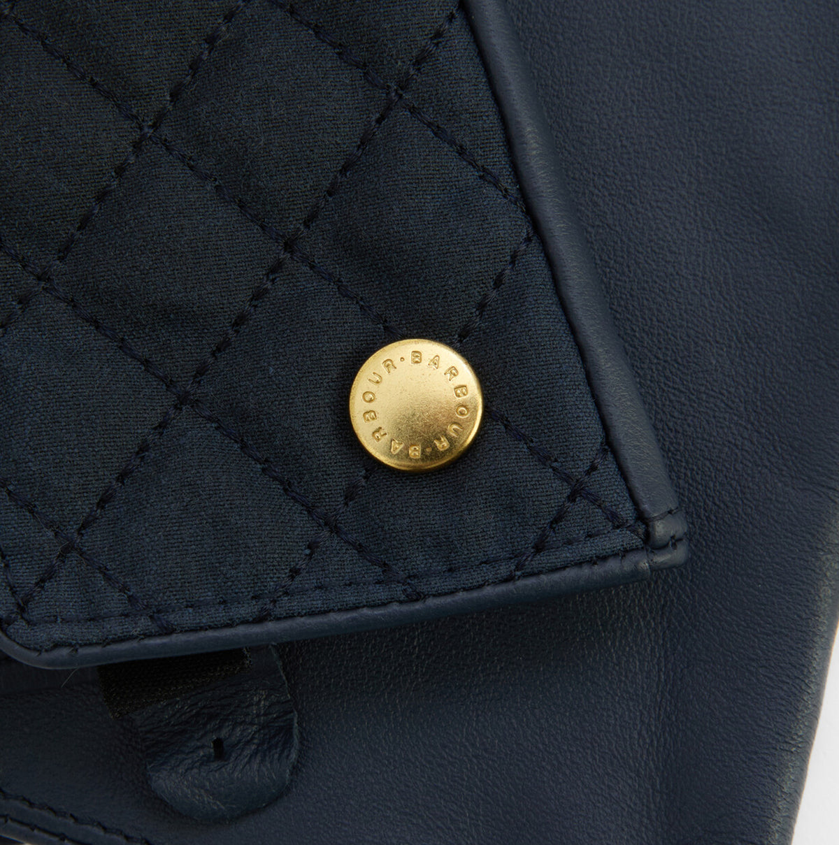 Barbour SCARLET Womens Touchscreen Gloves Navy detail view showcasing gold branded rivet on quilted leather.
