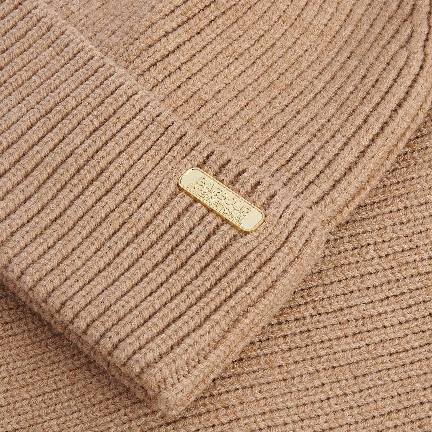 Detail view of Barbour MALLORY BEANIE AND SCARF Gift Set Womens Light Trench showing ribbed texture and logo.