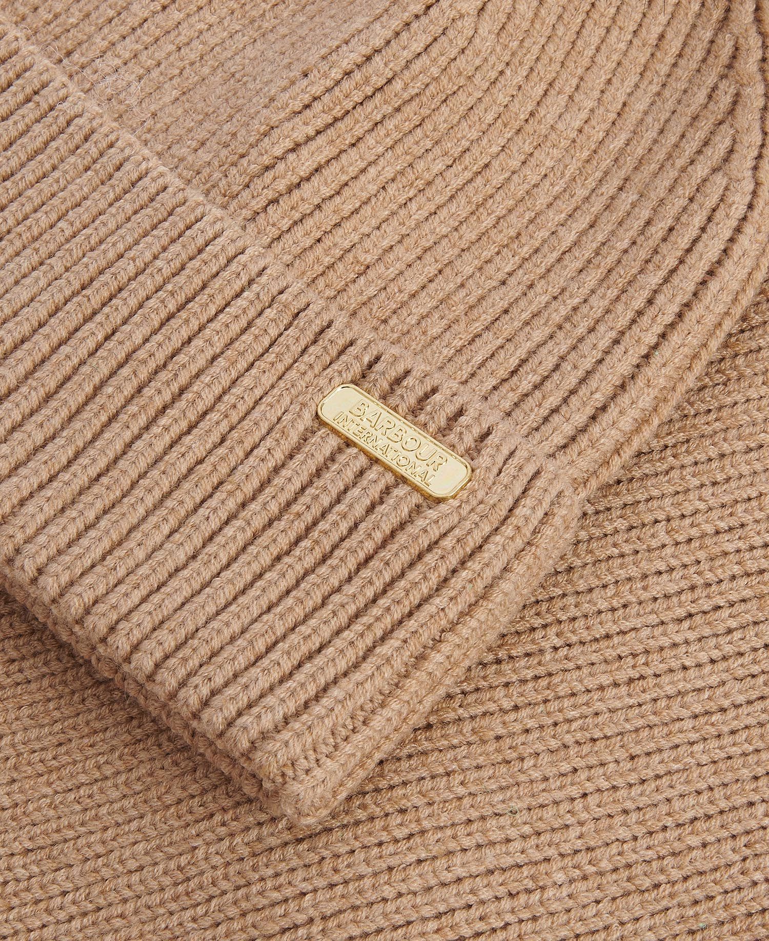 Detail view of Barbour MALLORY BEANIE AND SCARF Gift Set Womens Light Trench showing ribbed texture and logo.