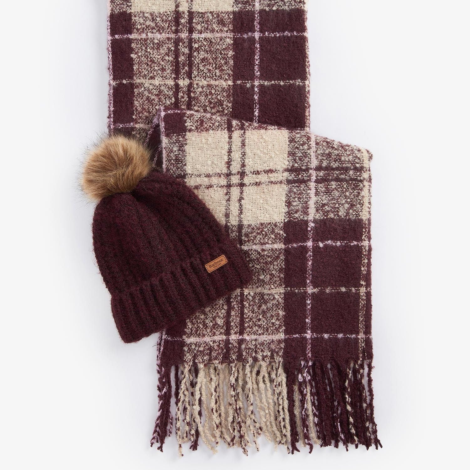 Barbour SALTBURN BEANIE AND TARTAN SCARF Gift Set Womens Cabernet showing beanie with faux fur pom and tartan scarf laid flat.