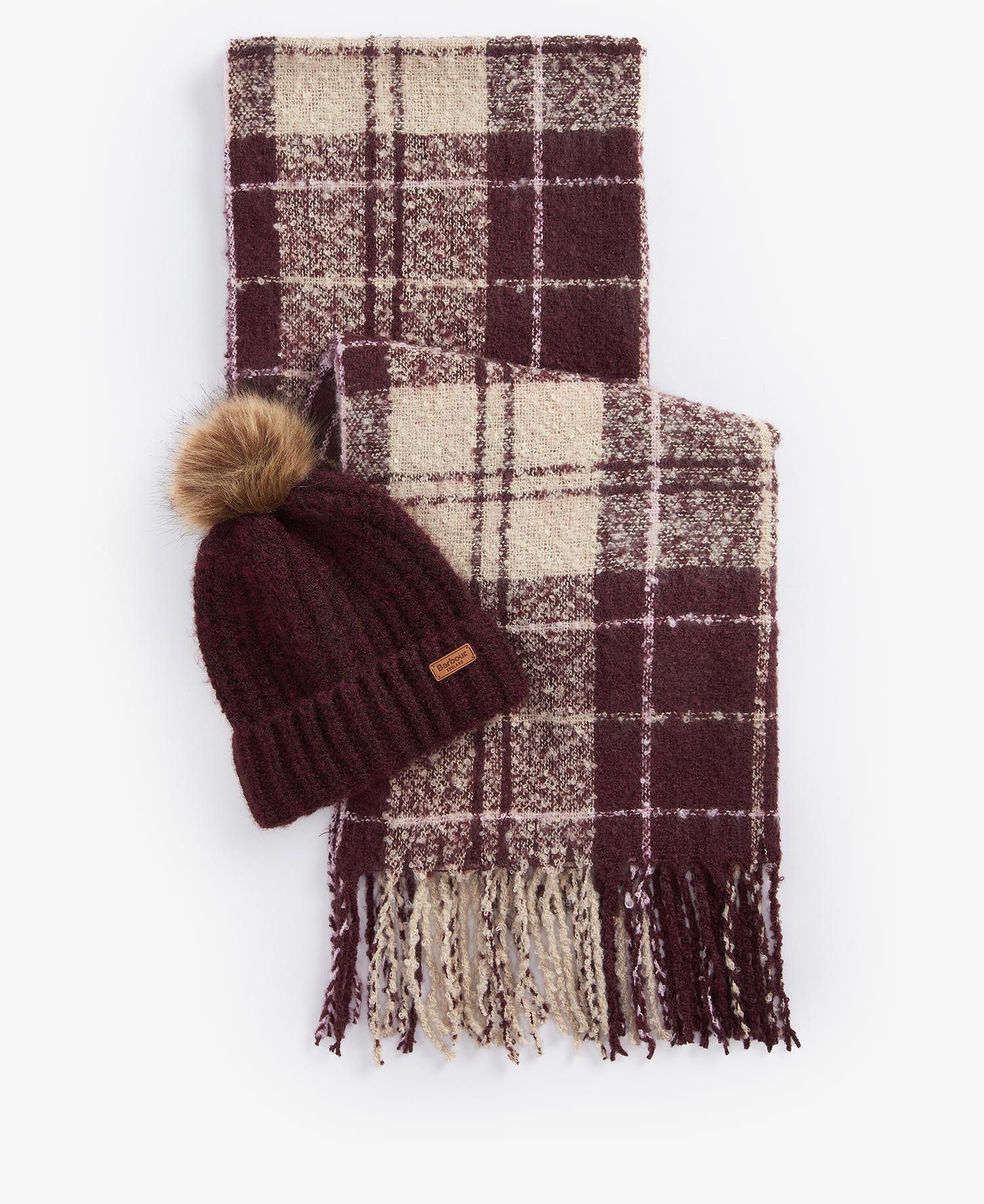 Barbour SALTBURN BEANIE AND TARTAN SCARF Gift Set Womens Cabernet showing beanie with faux fur pom and tartan scarf laid flat.