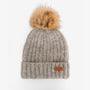 Barbour TRAVEL MUG & BEANIE Gift Set Womens Pink/Grey detailed view of beanie with faux fur pom pom in beige.