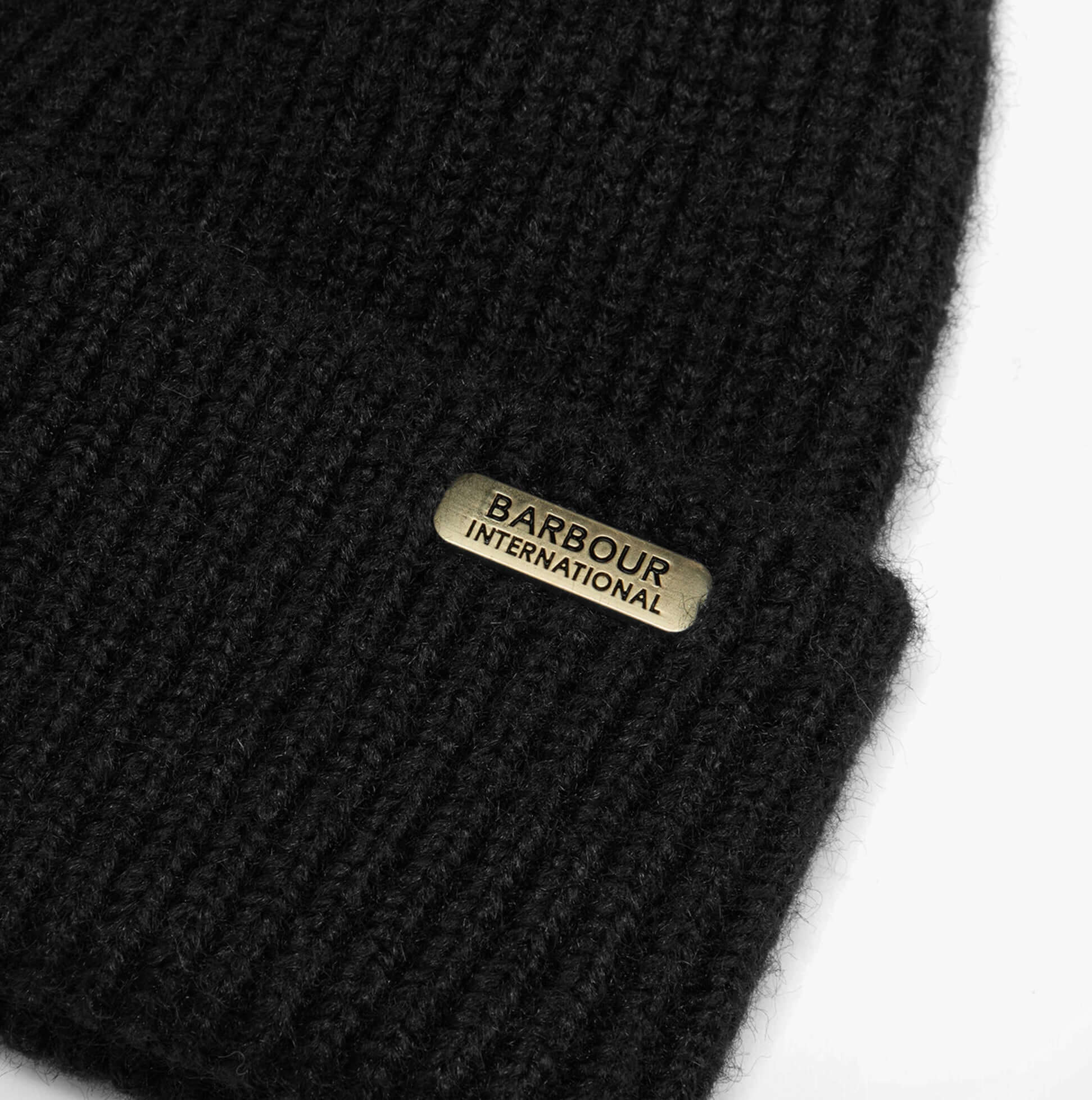 Barbour PENDLE BEANIE & MILLA SCARF Gift Set Womens Black/Jasmine detail view of the black beanie with logo patch.