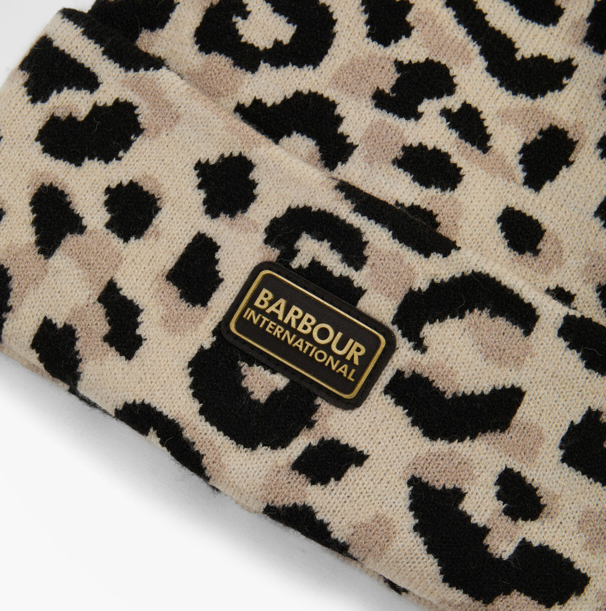 Barbour HARLEY LEOPARD Womens Beanie Jasmine Leopard detail view showcasing leopard print pattern and logo.