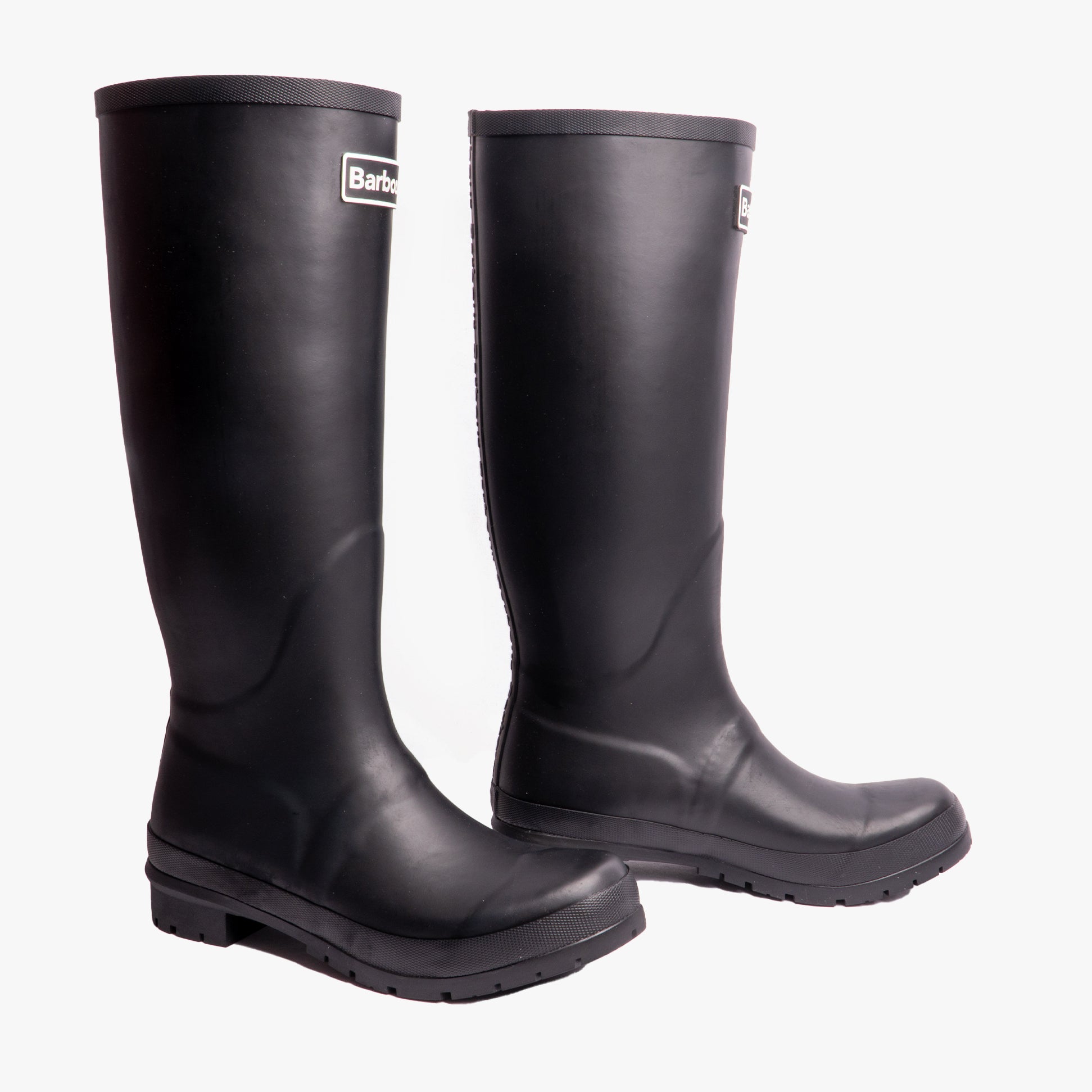 Barbour ABBEY Womens Wellington Boots Black side view showcasing pull-on design and knee-high rubber construction.