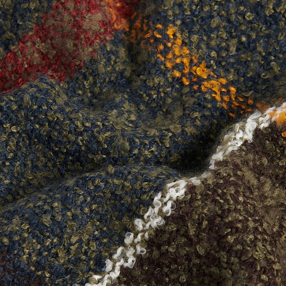 Barbour TARTAN BOUCLE Scarf Womens Classic detail view of textured boucle yarn in dark green, navy, orange, and brown.