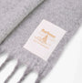 Barbour ELLISON Womens Winter Light Grey close-up view of tag showcasing brand label and detail.