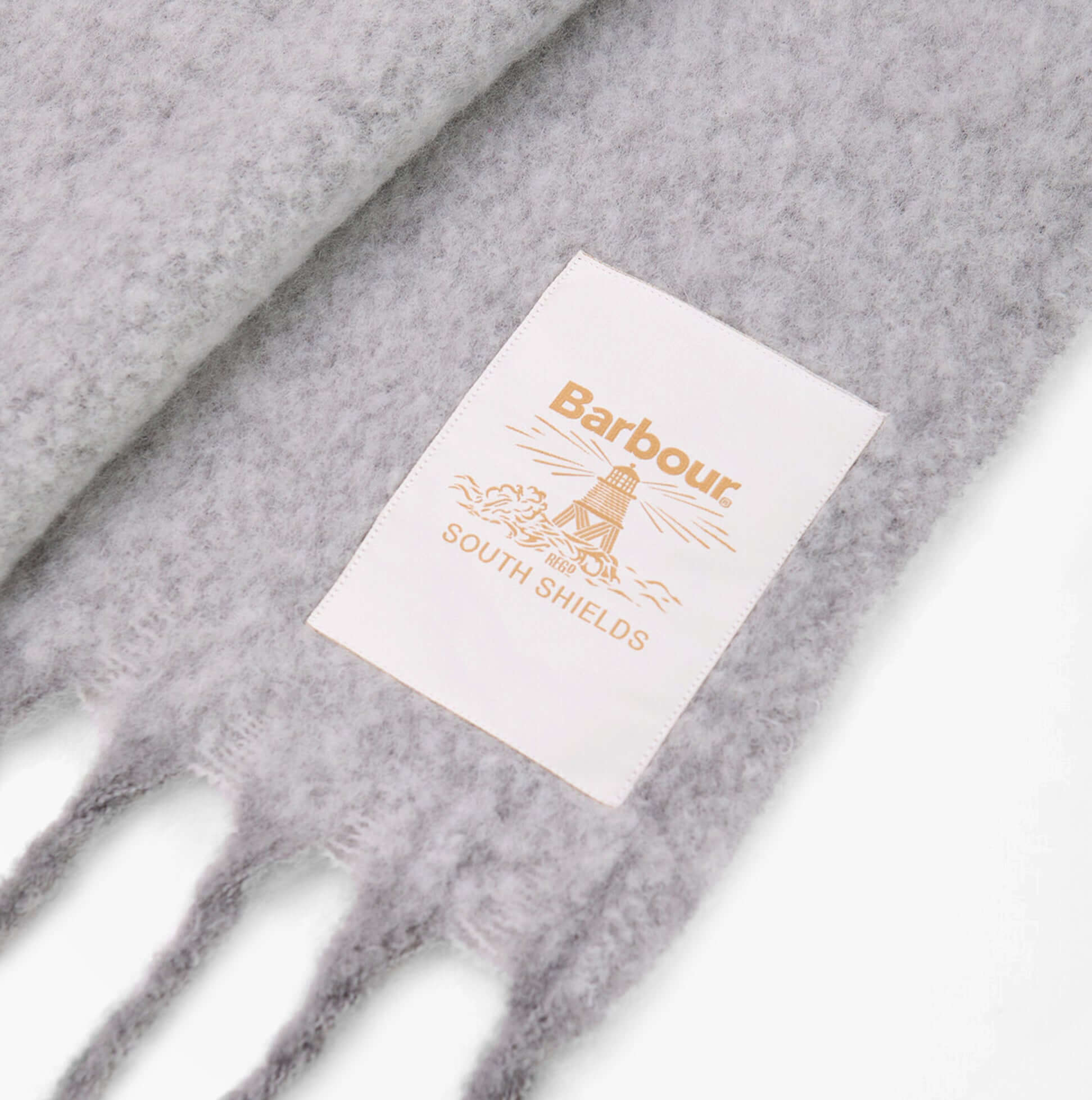 Barbour ELLISON Womens Winter Light Grey close-up view of tag showcasing brand label and detail.