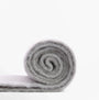 Barbour ELLISON Womens Winter Light Grey rolled scarf viewed from the side, showcasing its soft texture and color.