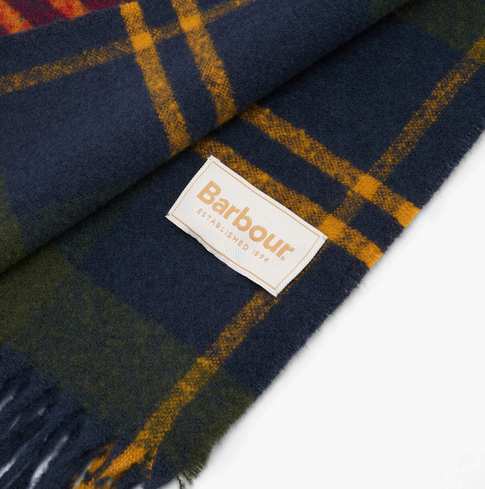 Barbour DEANNA TARTAN Womens Winter Winterberry Tartan close-up detail of the fabric showing label and tartan pattern.