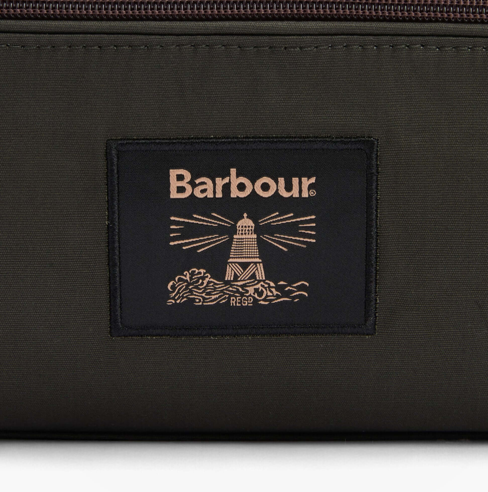 Barbour WAXED Mens Washbag Olive/Beacon detail view of logo on fabric.
